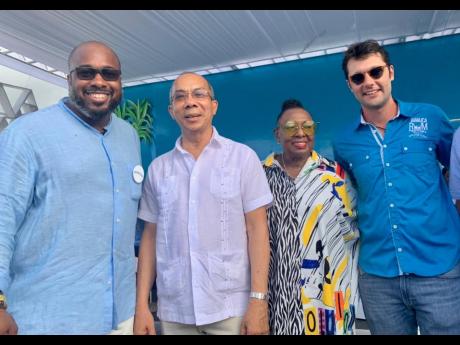 Minister of National Security Dr Horace Chang (second left), and Minister of Culture, Gender, Entertainment and Sport Olivia 'Babsy' Grange arrive at the 2022 Jamaica Rum Festival. They are joined by Mark Telfer (left), regional brand manager, Appleton Est