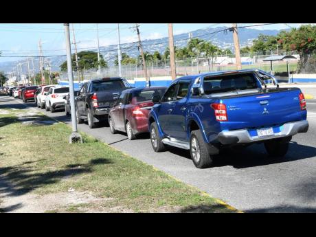 A long line of traffic is seen on Old Hope Road, St Andrew, as motorists queue up for COVID-19 tests at MD Link’s drive-through centre on Tuesday. Jamaica’s COVID-19 positivity rate has skyrocketed into the 40 per cent range two days in a row as a four