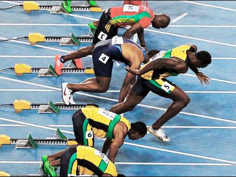 In this Sunday, August 28, 2011 file photo, Jamaica’s Usain Bolt, third from bottom, false starts from the men’s 100-metre final at the World Athletics Championships in Daegu, South Korea.