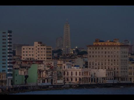 Deteriorated buildings line the Malecon seawall in Havana, Cuba, Wednesday, June 22, 2022.