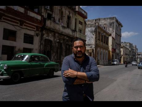 Architect Orlando Inclan poses for a photo on a street in Havana, Cuba, Monday, June 13, 2022.