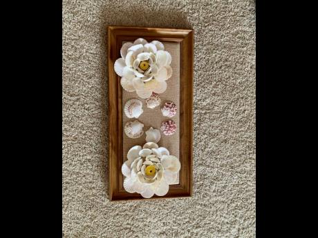 New artist Caleen Diedrick combined her love for shells and flowers to create this framed masterpiece. 