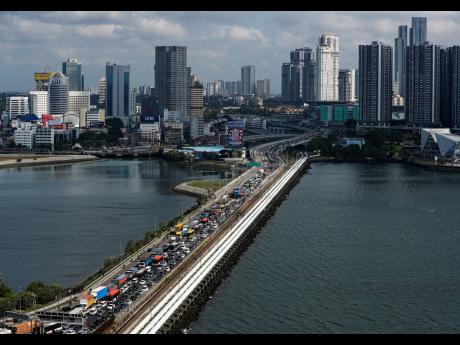 Johor–Singapore Causeway that links the city of Johor Bahru in Malaysia across the Straits of Johor to the district and town of Woodlands in Singapore. 