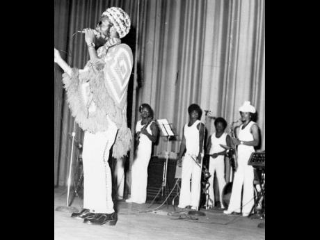 Big Youth makes his contribution to the United Artistes presentation, ‘Showcase 73’, at the Regal Theatre in this 1973 file photograph donning a poncho. 