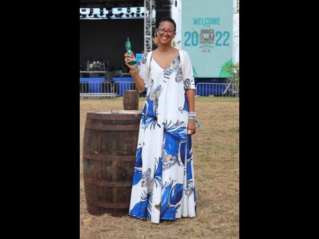 Wearing an airy maxi dress and equipped with a mobile fan, Alison Moss-Solomon, internal communications and employee engagement at J. Wray & Nephew Limited, is the epitome of cool and comfortable.