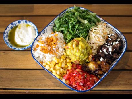 Jasmine rice, tossed salad, Cajun black beans, corn and salsa, with Chorizo smoked sausage has all the elements of a picture-perfect painting.