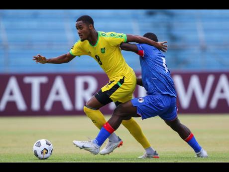 Jamaica’s Christopher Pearson carries the ball during their game against Haiti in the Concacaf Under 20 Championship at the Olimpico Metropolitano stadium in San Pedro Sula, Honduras on Sunday.