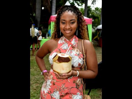Jacquel Johnson cools down with some ice cold coconut  water. 