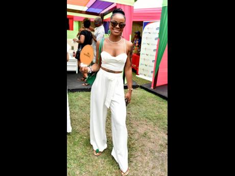 Suelle Anglin hit those style notes in an elegant, crisp white set and green accessories.