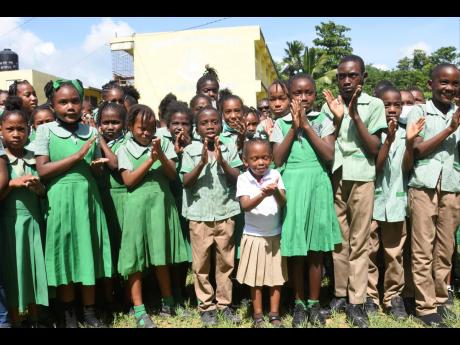 Students of Bickersteth Primary and Infant School in Bickersteth, St James, gather for a photo op following a ground-breaking ceremony for the opening of a new green space at the school on Thursday, June 30.