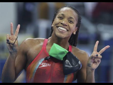 Alia Atkinson celebrates after winning the gold in the women’s 100m breaststroke at the 14th FINA World Swimming Championships in Hangzhou in eastern China’s Zhejiang Province on Saturday, December 15, 2018.