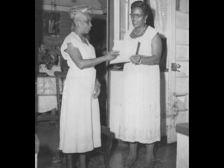 
In this 1957 photo, Leila James Tomlinson, founder of the islandwide family council, is seen with Elfreda Watson, foundation member of the council and founder of the Whitfield Town (No. 1). 
