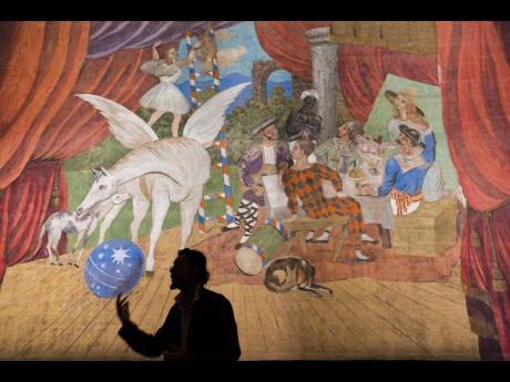 
In this 2017 photo art, historian Michele Di Monte explains to international journalists, Pablo PIcasso’s 17x11-metre curtain design for the production of Parade, an avant-garde theatrical extravaganza that opened in Paris in May 1917.
