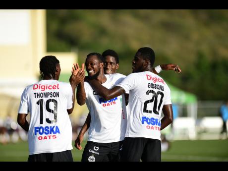 
Cavalier SC’s Kenroy Campbell (second left) celebrates a goal scored with teammates in the Jamaica Premier League.