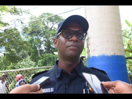 Superintendent of Police in charge of Operations in the St James division, Eron Samuels, being interviewed following the official opening of a new park and greenspace at the Lethe Primary and Infant School in Lethe, St James, on Thursday, June 30.