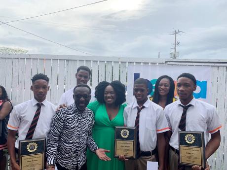 (Front row, from left) Pictured are Shane McIntosh; recipient; Owen ‘Blakka’ Ellis, president of the Optimist Club of Trench Town; Keisha Smith, secretary of the Optimist Club of Trench Town; Akon Douglas, recipient; and Zachary Skeine; recipient. In t