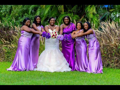 The glowing bride Andrene Lewis (centre), is supported by her bridesmaids and maid of honour (from left) Alesia Golding, Antonett Dunn, Trudette Davis, Shalama Khouri and Carneelya Hamilton-Bennett.