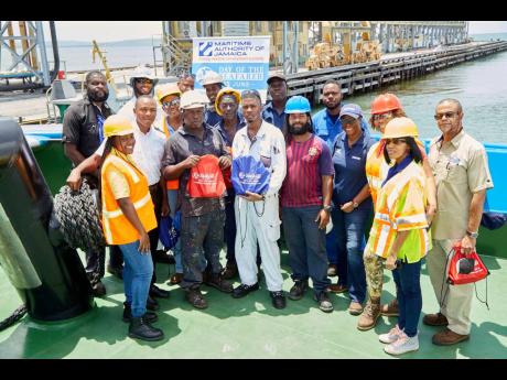 The Maritime Authority of Jamaica team visiting the crew from ‘AJAX’, portside towing, at Port Esquivel. 
