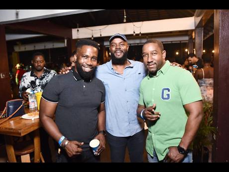 From left: Entrepreneur Jermaine Brown; Kemar Lewis, category manager for spirits, Caribbean Producers Jamaica Ltd (CPJ); and Rojah Thomas, commercial director (retail division), CPJ, enjoyed the festivities at Bello B Birthday Bash.