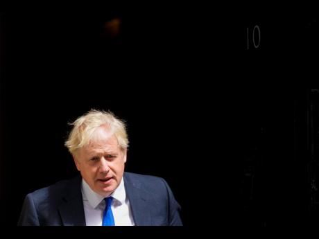 British Prime Minister Boris Johnson leaves 10 Downing Street in London yesterday. 