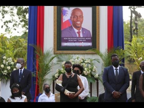 First Lady Martine Moise (centre) attends a memorial service for her late husband, President Jovenel Moise, at the National Pantheon Museum, in Port-au-Prince, Haiti, on July 21, 2021. 