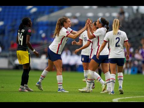 United States' Sophia Smith (second from right)  is congratulated by teammate after scoring her side's second goal against Jamaica during a Concacaf Women's Championship football match in Monterrey, Mexico, Thursday, July 7, 2022. 