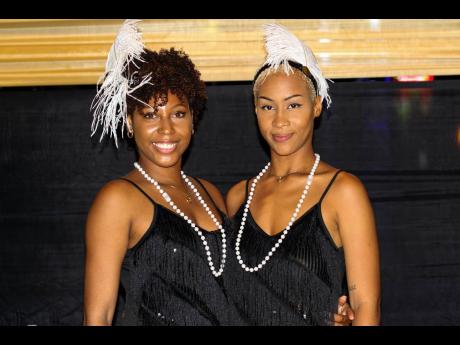 The pleasant faces of Nakita Reid (left) and Taiya Wilson greeted patrons at the gate and made sure they were fashionably feathered and ready to fête at Bacchanal Premium last Wednesday.