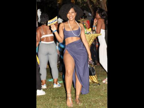 Ariane Baynes’ lavender wrap skirt and crop top set fit like a glove. 