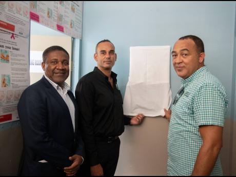 From left: Member of Parliament for Kingston East and Port Royal Phillip Paulwell; Gerard Fontaine, president, Fraser, Fontaine and Kong Limited and Minister of Health and Wellness Dr Christopher Tufton at the unveiling of a plaque at the Port Royal Health