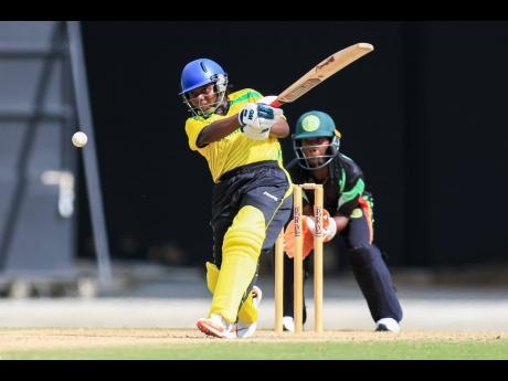 Lena Scott of Jamaica goes on the attack during her innings of 43 against Guyana in their Cricket West Indies Rising Stars Women’s Under-19 match at the Brian Lara Cricket Academy yesterday.