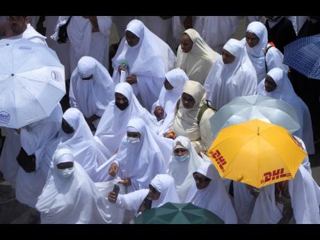 
Muslim pilgrims move on their way to perform Friday Prayers at Namira Mosque in Arafat, on the second day of the annual hajj pilgrimage, near the holy city of Mecca, Saudi Arabia on Friday.