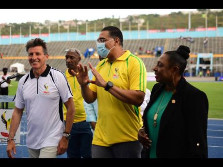 From left: Lord Sebastian Coe (President, World Athletics), Garth Gayle (President, Jamaica Athletics Administrative Association), Prime Minister Andrew Holness and Minister of Culture, Gender, Entertainment and Sport Olivia Grange at the  National Stadium