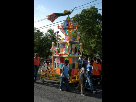 Residents of south Clarendon pull a tower during Hosay celebrations at Water Lane on August 19, 2006. Hosay celebrates the death of two brothers, whose descendants became Shia and Sunni Muslims. The tradition has been celebrated in Jamaica since the arriva