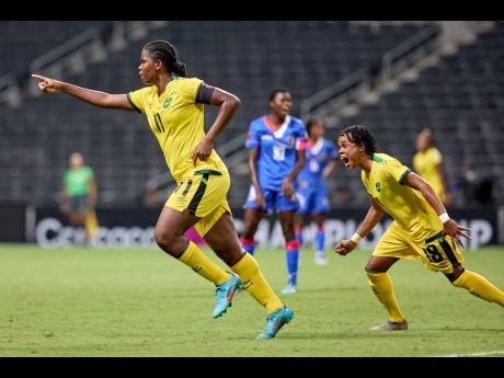 Jamaica’s Khadija Shaw (left) celebrates scoring a goal to help her team to a 4-0 win over Haiti in a Concacaf Women’s Championship football match at the Estadio BBVA in Monterrey, Mexico, on Monday. Helping her celebrate is teammate Trudy Carter.