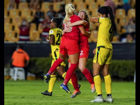 Canada's Allysha Chapman (centre)  is congratulated by a teammate after scoring her side's second goal against Jamaica during their Concacaf Women's Championship semi-final match in Monterrey, Mexico on Thursday night. Canada won 3-0.