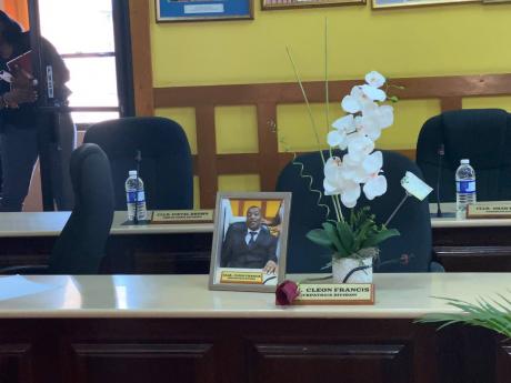 A photo of late Councillor Cleon Francis sits on a desk during Thursday’s meeting of Manchester Municipal Corporation.