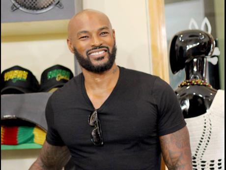 Top: With plans to retire in Jamaica,Tyson Beckford said it has been rough seeing from a distance what has been happening on the island.