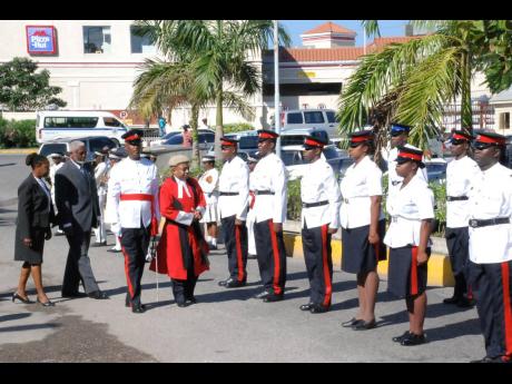 In this 2008 file photo, Judge Lennox Campbell inspects the guard of honour during the opening of the St James Circuit Court.
