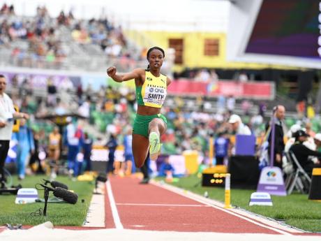 
Ackelia Smith hurtles down the runway at the Hayward Field on her way to the final of the women’s triple jump  to become one of three Jamaican qualifiers to the World Athletics Championships final yesterday.
