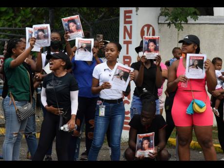 Relatives and friends of Donna-Lee Donaldson, the missing social-media influencer, protest Sunday along Chelsea Avenue across from an apartment complex where she was reportedly last seen. 