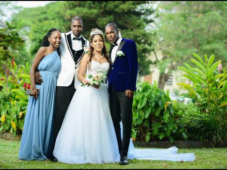 Mr and Mrs Vanzie were excited to celebrate this special occasion with their children, Krishelle Vanzie (left) and Saiheif Foster. 