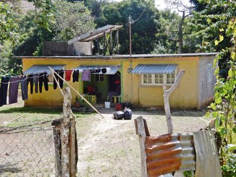 The house in Free Hill, near Bamboo, St Ann, where three bodies were discovered on Monday morning.