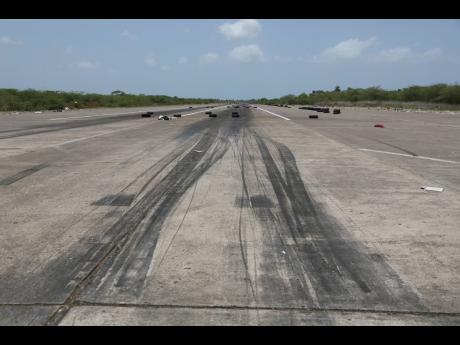 Skid marks are seen on the racetrack of the Vernamfield Aerodrome in Clarendon on Monday.
