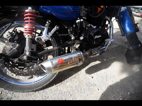A motorcycle with a modified muffler.
