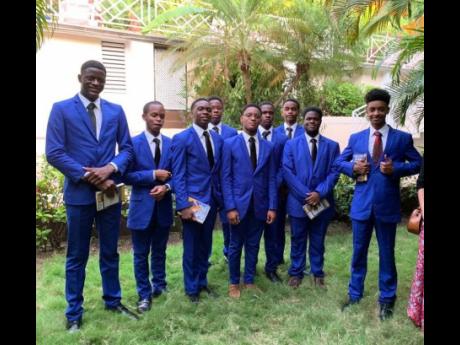 Romulus Deenah (right) and the Stellar Gent participants donned their new suits for dinner at Deja Resort, sponsored by Robin Russell.