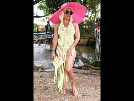 Crochet coverups are in the spotlight for the summer and Carleen McCalla successfully rocked her neon green outfit with a pop of pink in her beach hat.