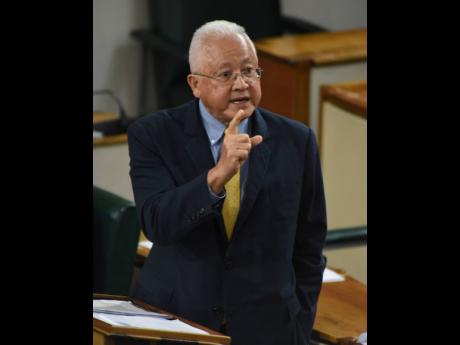 Delroy Chuck, the minister of justice, addressing lawmakers during Tuesday’s sitting of the House of Representatives.