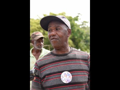 Earl Smith, whose three grandchildren were among the five members of a Clarendon family slain last month, says he is still struggling to come to terms with the loss. On Tuesday, he was at the Sutton Memorial Cemetery assisting with preparation work for the