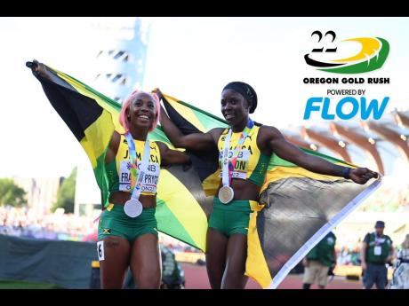 Jamaica's Shericka Jackson (right) and Shelly-Ann Fraser Pryce celebrate a one-two finish in the women's 200-metre on day seven at the World Athletics Championships in Eugene, Oregon.