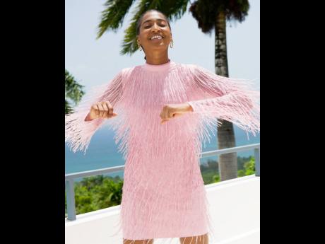 Shot in Montego Bay at Destiny Villa and styled by Harriet Davey for the British mag ‘Stylist’, Tash Ogeare rocks a River Island beaded fringe smock.